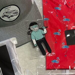 Yeti in in golf polo divot tool